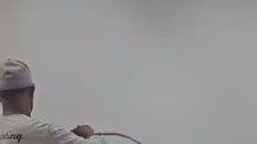 Painter spraying a smooth interior wall finish