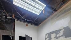Commercial suite interior with new drywall and ceiling work in progress