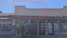 Commercial storefront before repainting the fascia